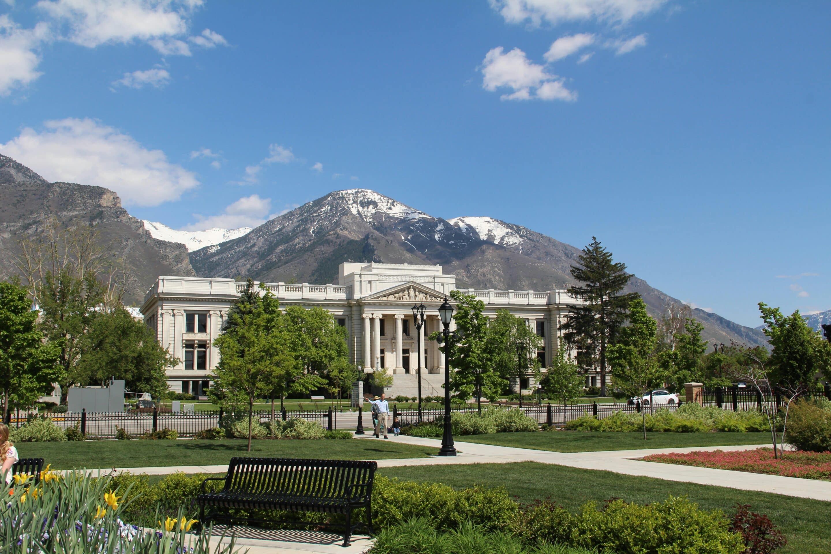 Historic building in Provo with mountains in the background, symbolizing strength and recovery.