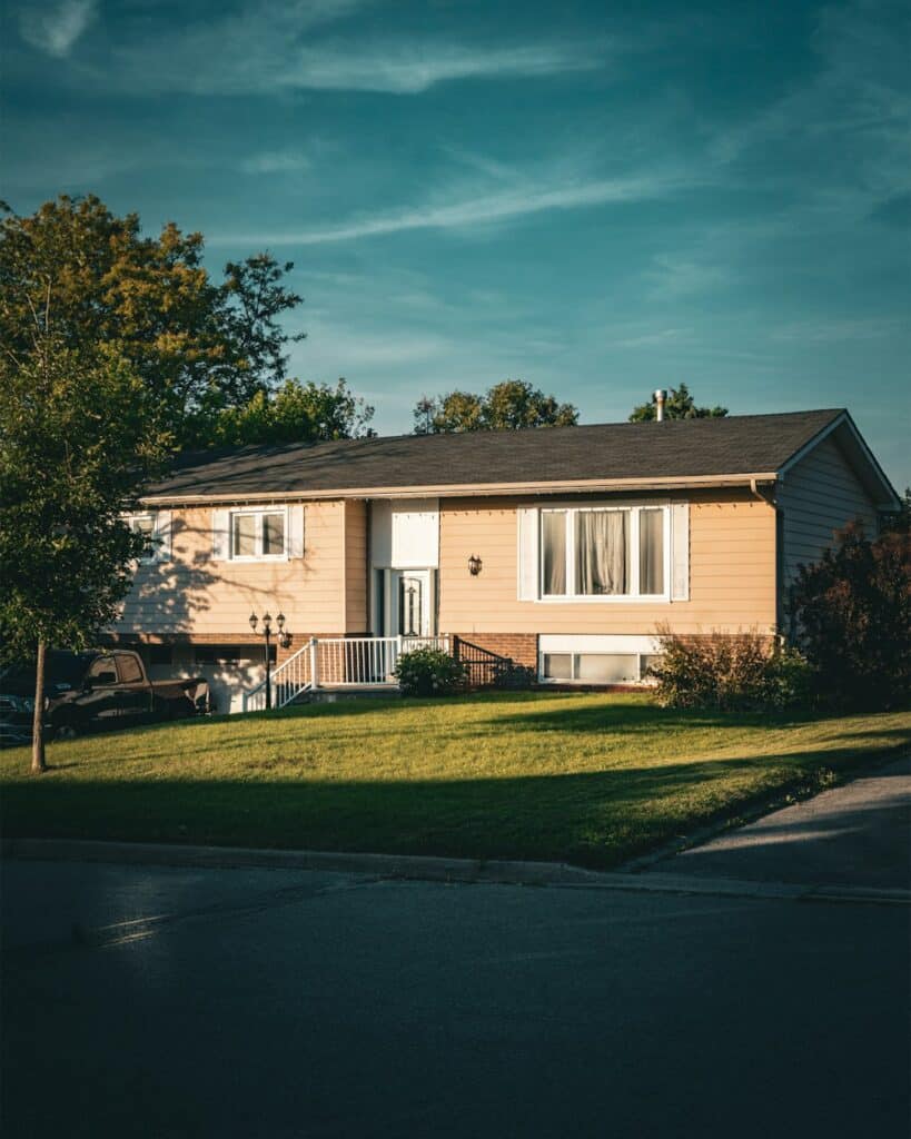 A house sitting on the side of a road -- Photo by Michael Huh on Unsplash