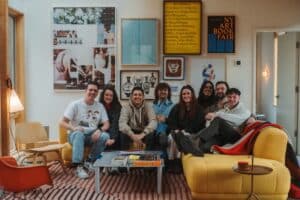 A group of people sitting on a couch -- Photo by Michael Proctor on Unsplash