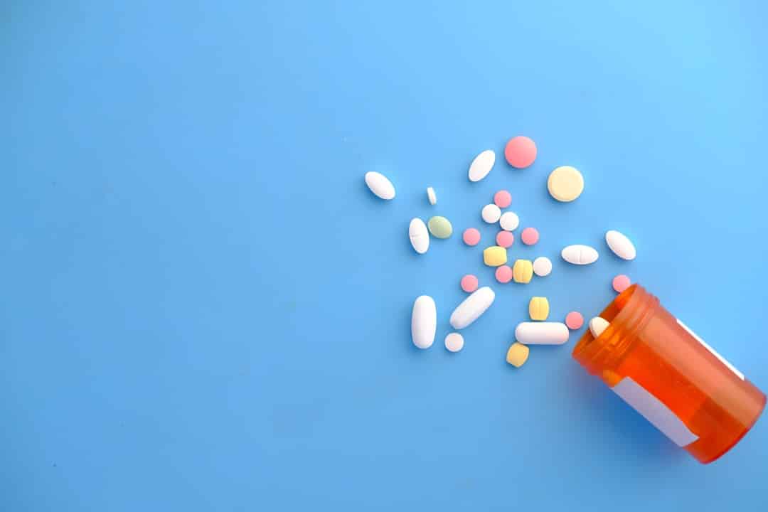 orange and white medication pill -- Photo by Towfiqu barbhuiya on Unsplash