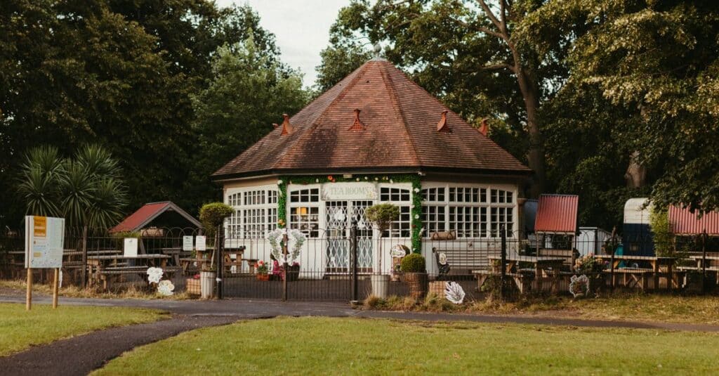A quaint tea room amidst lush greenery in a Dublin park, perfect for a serene break.