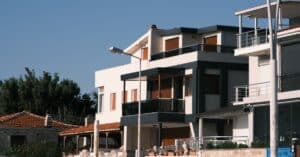 Contemporary and traditional homes in Foça, İzmir, showcasing modern design against a clear sky backdrop.