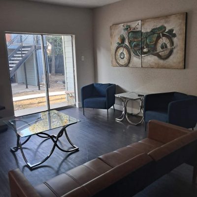 Shared two-man suite sober living in Austin with modern décor, natural light, and comfortable seating