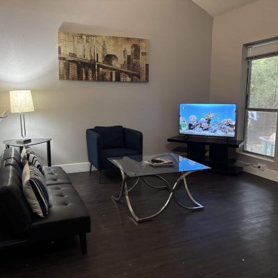 Affordable two-bedroom men’s sober apartment in Austin with modern furniture and natural light