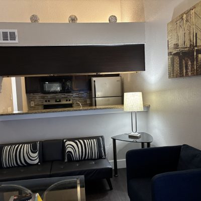 Two-bedroom men’s sober apartment kitchen in Austin with modern furnishings and open layout