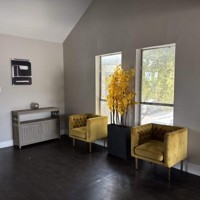 Bunk sober living bedroom in Austin for men with metal bed frames and hardwood floors