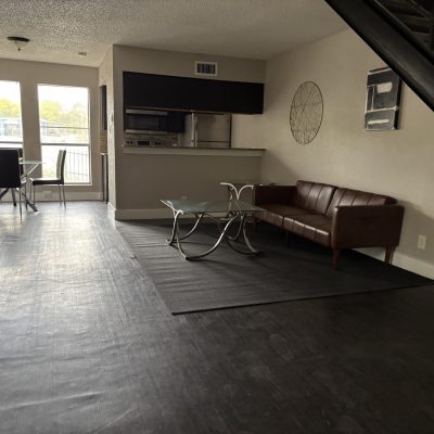 Kitchen and dining area in men’s bunk sober living apartment Austin