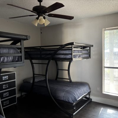 Budget men’s sober housing with two bunk sets and natural light in Austin